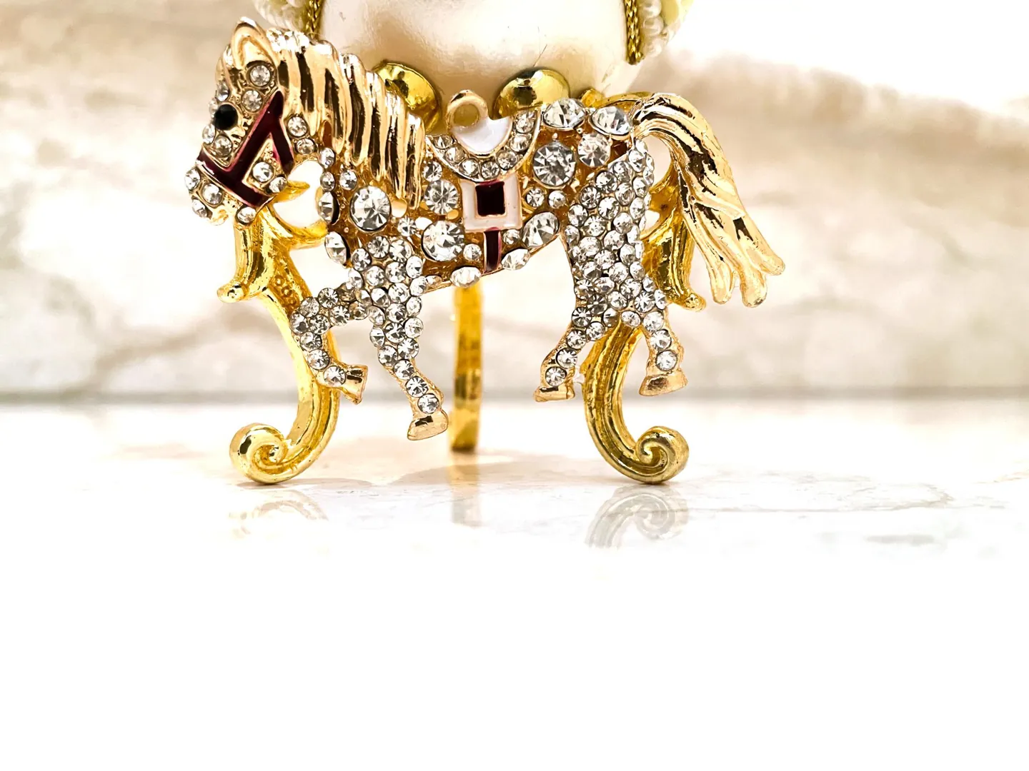 Vintage 2015 Faberge Egg Necklace featuring a Musical Carousel. Hand-carved natural egg with pure gold detailing and Swarovski diamonds. A perfect 10th anniversary gift for a wife.