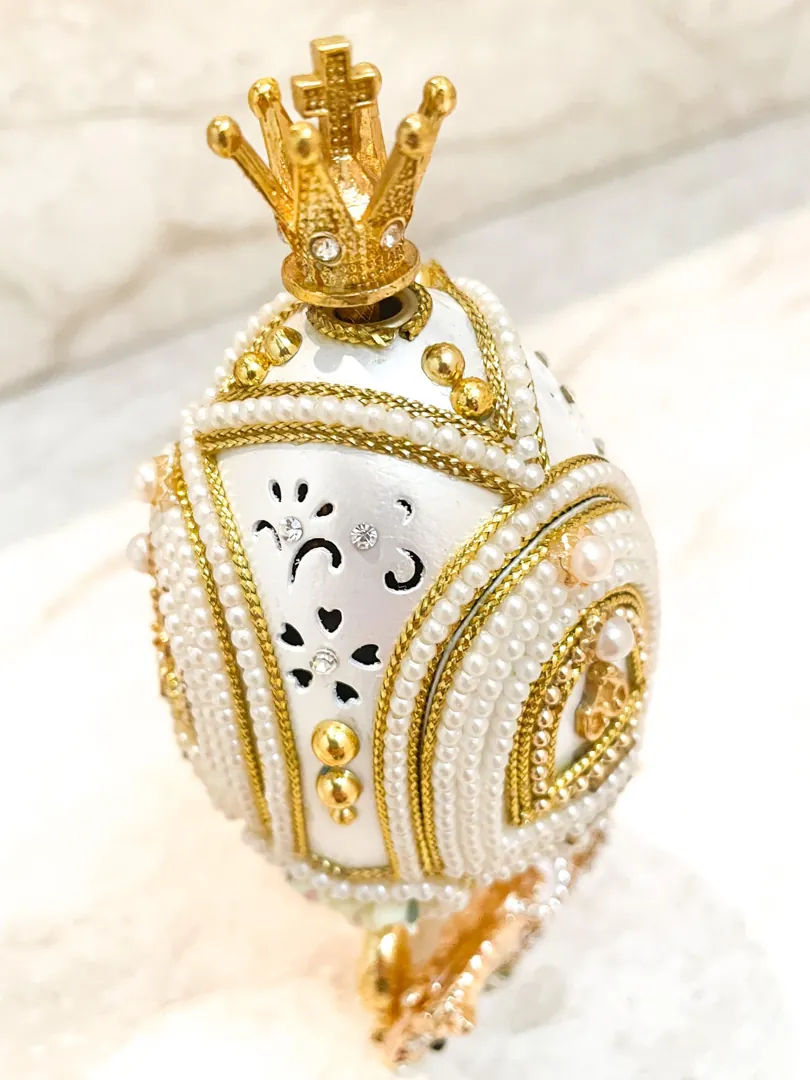 Vintage 2015 Faberge Egg Necklace featuring a Musical Carousel. Hand-carved natural egg with pure gold detailing and Swarovski diamonds. A perfect 10th anniversary gift for a wife.