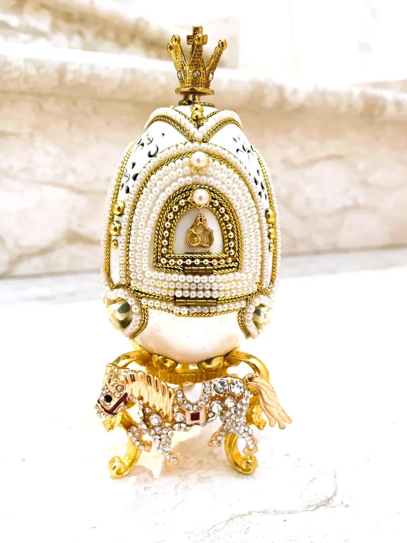 Vintage 2015 Faberge Egg Necklace featuring a Musical Carousel. Hand-carved natural egg with pure gold detailing and Swarovski diamonds. A perfect 10th anniversary gift for a wife.