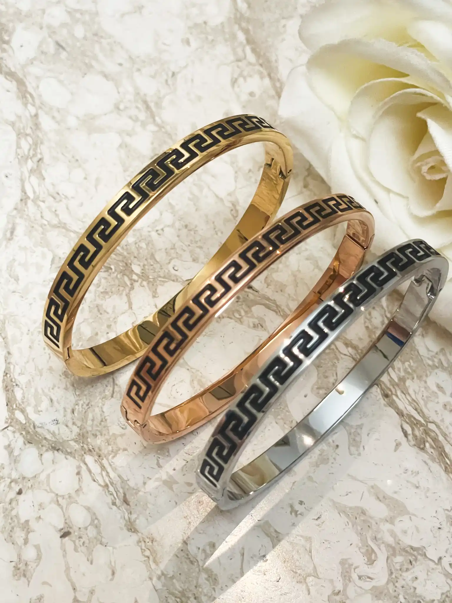 3 x Meander Bracelets - 8mm Greek Key Bangle HANDMADE Jewelry Gift Infinity Bangle Bracelet Greek Jewelry for Women Graduation Success HANDMADE by Pierre Lorren

🏺Handmade by our in-house master jewelers in Cyprus—on the island of beauty and love, Aphrodite

🏺 Vermeil-style 18K gold over sterling silver for a warm, opulent sheen

🏺 The 8 mm broad Greek Key/Mander motif represents harmony, eternity, wealth, and endless life.

🏺 Stylish clip/box fastening for a snug, cozy fit

🏺 Classic geometric style that enhances both special occasion and daily ensembles

sharp lines, a high-gloss finish, and painstaking, handmade workmanship

🏺 A thoughtful present for milestones, anniversaries, Christmas, New Year's, and birthdays

🏺 Present-ready: comes with a certificate of authenticity and in a Pierre Lorren box and bag.

🏺 Versatile styling: looks great with gold or silver pieces and stacks with bangles.

🏺 Skin-friendly and nickel-free materials for comfortable daily use in 