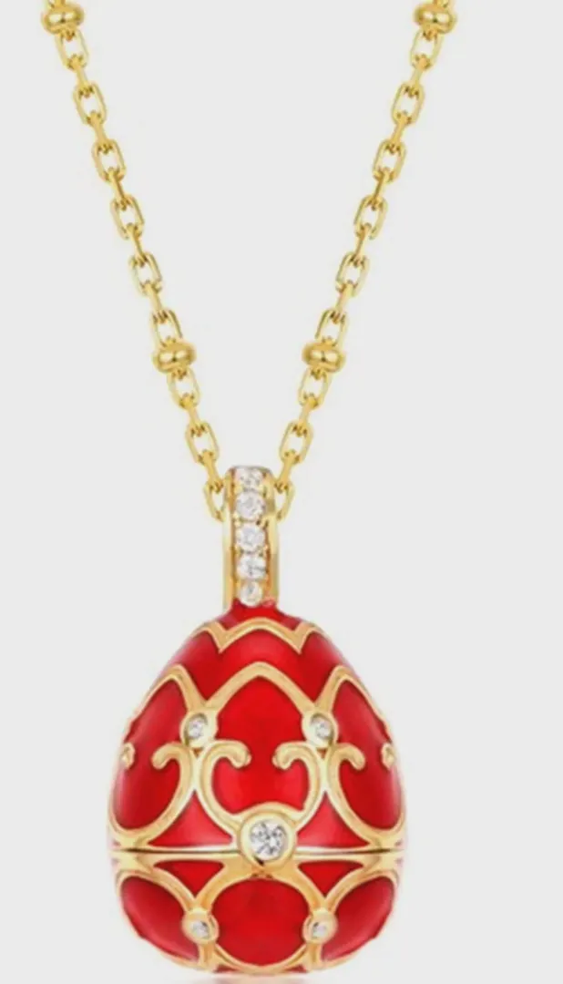 The Pierre Lorren Silver Faberge egg is a handcrafted piece featuring a red design. It showcases intricate detailing, typical of Faberge-style artistry. If you have specific questions about it or need more information, feel free to ask!