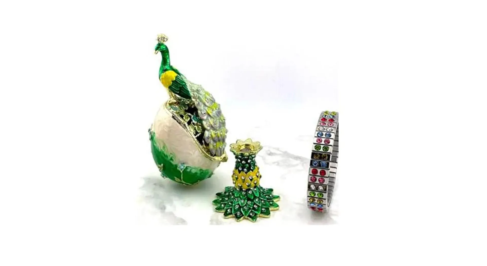 Designr Green Faberge Easter Eggs in the Russian Faberge style, featuring Swarovski elements and pure gold decoration. This handmade piece makes a perfect graduation luck gift for your daughter by Pierre Lorren.