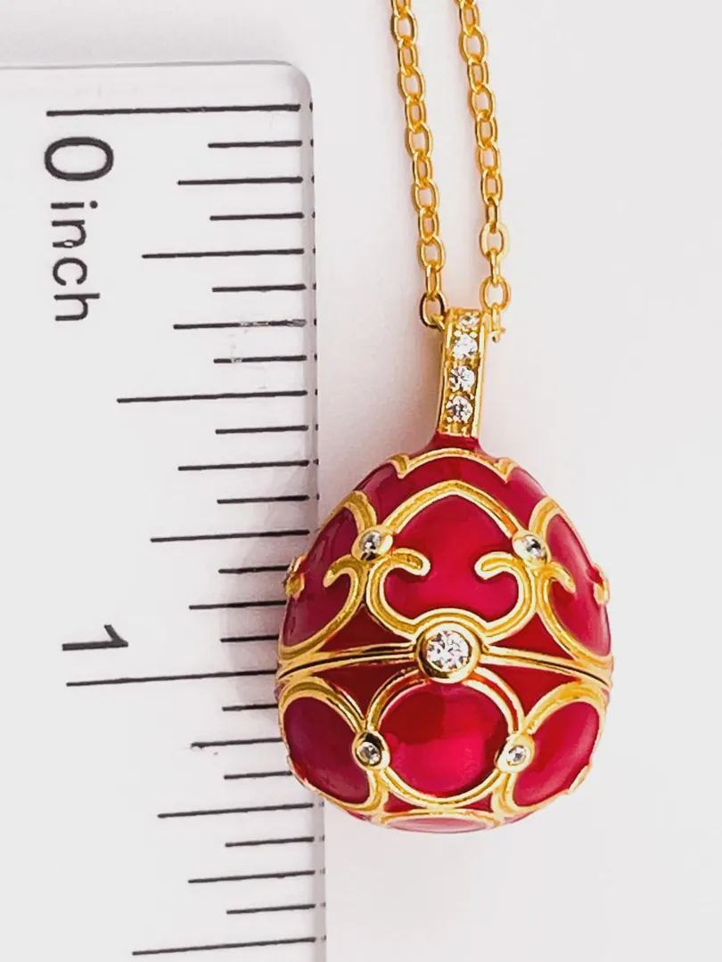 The Pierre Lorren Silver Faberge egg is a handcrafted piece featuring a red design. It showcases intricate detailing, typical of Faberge-style artistry. If you have specific questions about it or need more information, feel free to ask!